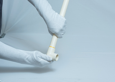 In this image, the professional is ensuring that the CPVC cement used for has cured well. The curing time for CPVC pipes is shorter in drier environments, for smaller sizes, and at higher temperatures. Typically, it takes a joint around 10 to 20 minutes for the CPVC pipes’ cement to cure fully.