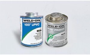 Applying primer and solvent cement to uPVC pipe and fitting for strong, leak-proof joint in agricultural plumbing